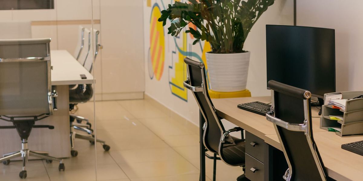 Desks inside the Resource Realty brokerage office in Little Rock where agents on a 90/10 split work